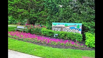 a sign for the entrance to a pine brook park at Pine Brook 1111 I State of the art 15 Bd Apt in Newark