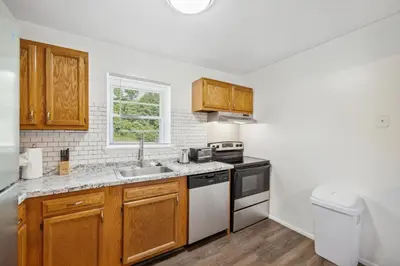 a kitchen with a sink and a stove top oven at Pine Brook 1122 I Pool Gym I Free Parking ! in Newark