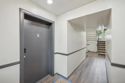 a hallway with a door in a room at Pine Brook 1302 I Pool Gym I Free Parking ! in Newark