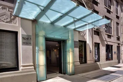 a glass entrance to a building on a city street at 73-308 New 1BR 1Bth UWS Doorman Gym in New York