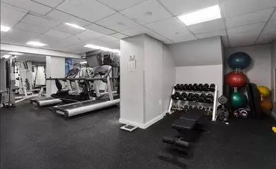 a gym with lots of exercise equipment and balloons at 73-1406 New 1BR 1Bth UWS Doorman Gym in New York