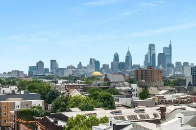a view of the city of philadelphia with buildings at Modern 1BR with Rooftop Pool & Gym in Philadelphia