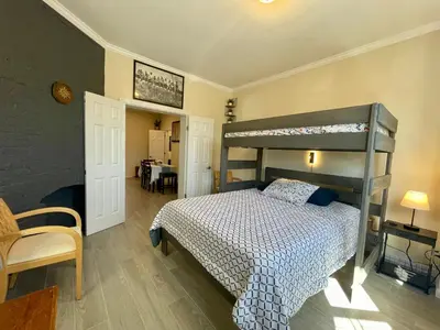 a bedroom with a bunk bed and a table at New York City Private Bedroom Near Free Ferry Boat! in Stapleton