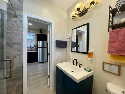 a bathroom with a sink and a mirror at New York City Private Bedroom Near Free Ferry Boat! in Stapleton