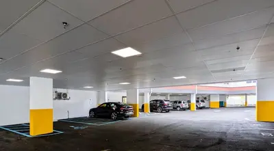 a parking garage with two cars parked in it at 315 Brand New 1 Bedroom 1 Bath 1 Full Kit 1 Liv in Dunellen