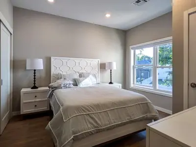 a bedroom with a large bed and a window at 310 Brand New 1 Bedroom 1 Bath 1 Full Kit 1 Liv in Dunellen