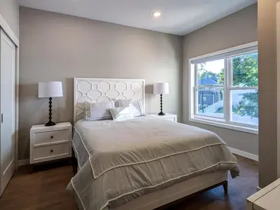 a bedroom with a large bed and a window at 310 Brand New 1 Bedroom 1 Bath 1 Full Kit 1 Liv in Dunellen
