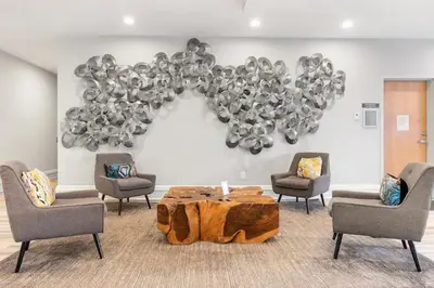 a room with a table and chairs and a bunch of balloons at Stylish 1BR - Rooftop Pool in Philadelphia