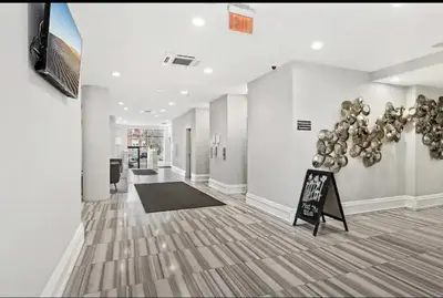 a hallway with a room with a bunch of balloons on the wall at Magnificent 1BR with Pool & Gym in Philadelphia