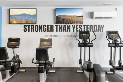 a gym with several exercise bikes in a room at Sleek 1BR with Rooftop Amenities in Philadelphia