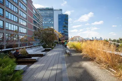 a sidewalk in a city with benches and buildings at Blueground Jersey City 1bd apartment NYC-1603 in New York