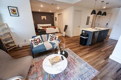 a living room with a couch and a table at Studio Apartment in the Heart of Philadelphia in Philadelphia