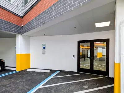 an empty parking lot with a door in a building at 329 Modern 1BR Apt Walk to NJT in Dunellen