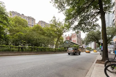 a car driving down a street in a city at Blueground Upper West Side ac wd NYC-1546 in New York