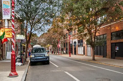 a car parked on the side of a city street at Spacious 3-Bedroom Apt in the Heart of Philly in Philadelphia