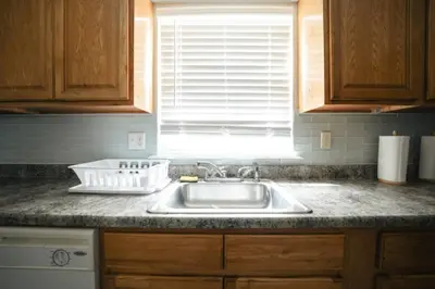 a kitchen counter with a sink and a window at Newark Liberty Brick House - Private Bedroom 4 in Newark