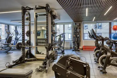 a gym with treadmills and tread machines at Blueground UWS gym elevator nr Central Park NYC-1443 in New York
