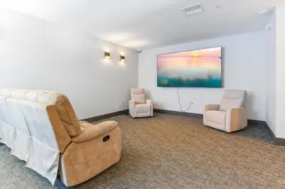 a room with two chairs and a painting on the wall at Amazing City Views - Sleeps 6 - Near Fishtown in Philadelphia