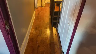 a hallway with a wooden floor in a house at 2218 N Colorado Master Queen Room in Dogwood Acres