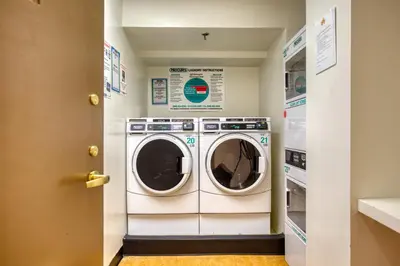 a laundry room with a washer and dryer at Blueground Upper West Side nr parks wd NYC-1678 in New York