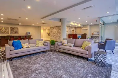 a living room with two couches and a table at XL Studio - Metro Studio, Chic Stay in Philadelphia