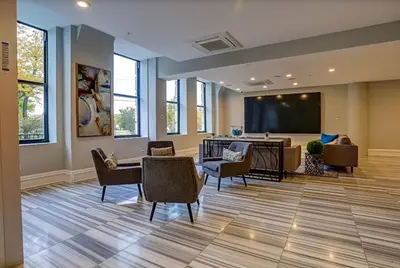 a waiting room with chairs and a projection screen at XL Studio - Metro Studio, Chic Stay in Philadelphia