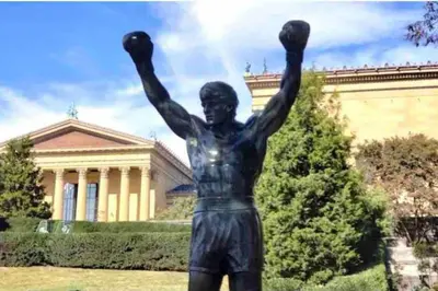 a statue of a man with his arms in the air at Downtown City Hall close by Kimmel Center 1BD in Philadelphia