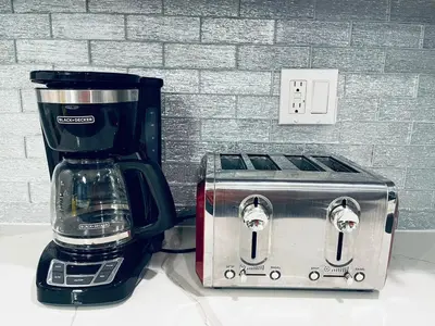 a coffee maker and a toaster sitting on a counter at Magic Gardens 1BD Apt in Center City in Philadelphia