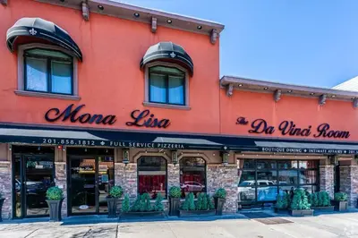 a red building with a sign for a momma line at Music - Big 3br with King Bd Close to EWR and NYC in Bayonne