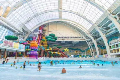 a group of people in a water park at Duplex apt - Dining - 80in Projector - Pool Table in Bayonne