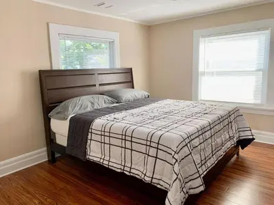 a bedroom with a bed and two windows at Lovely 1 BD downtown 2F apt in quite neighborhood in Montclair