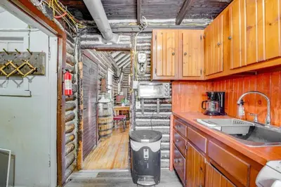 a kitchen with a sink and a counter top at The Rustic Cabin in Blakeslee