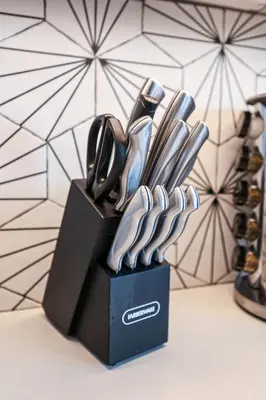 a black knife block with utensils in it at Studio Apartment in the Philadelphia in Philadelphia