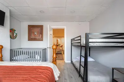 a bedroom with a bunk bed and a ladder to a bunk bed at Updated 3BR 2BA Apartment Near NYC Airport in Bayonne
