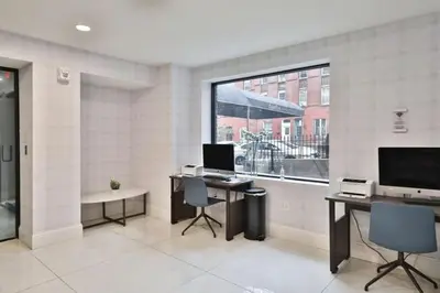 an office with two desks and a large window at Fairfax Apartments 425 Spacious 1 Bed 1 Bth in Philadelphia