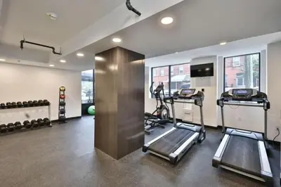 a gym with two tread machines in a room at Fairfax Apartments 603 Spacious 1 Bed 1 Bth in Philadelphia