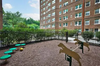 a playground with dogs and frisbees in front of a building at Fairfax Apartments 604 Spacious 1 Bed 1 Bth in Philadelphia