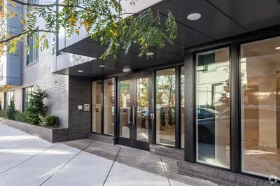 a store front with glass windows and a building at Courtyard Studio - Serene Space Gym Wi-Fi in Philadelphia