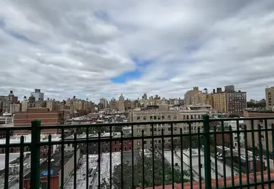 a view of a city from a balcony at Sunny Fully Furnished Studio in Chelsea in New York