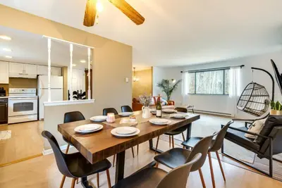 a dining room and living room with a table and chairs at Serenity Grove Game Room Fire Pit Dog Friend in Pocono Pines