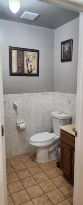 a bathroom with a toilet and a sink at Honey queen room 5 in Newark