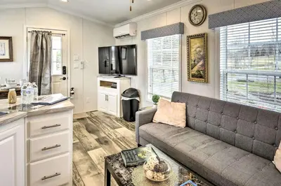 a living room with a couch and a kitchen at Great Vacation Complex for the Best Pennsylvania Glamping in Scranton
