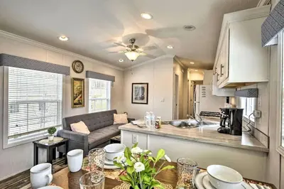 a kitchen and living room with a couch and a table at Great Vacation Complex for the Best Pennsylvania Glamping in Scranton