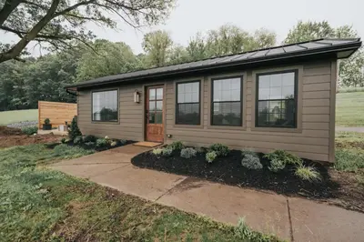a tiny house with a pitched roof at Luxury Cabin at Beaver Creek with hot tub and stunning views in Strasburg