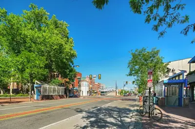 an empty city street with a bike parked at a traffic light at Charming Philly Stay Walk to Liberty Bell & More in Philadelphia