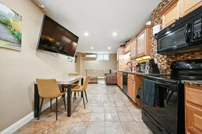 a kitchen with a table and chairs in a room at Charming Philly Stay Walk to Liberty Bell & More in Philadelphia