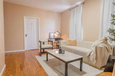 a living room with a couch and a coffee table at NYC Train EWR Liberty Park 2 in Bayonne