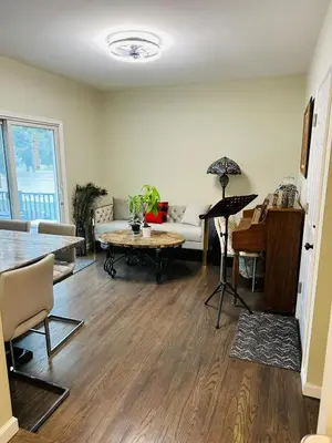 a living room with a couch and a table at The Trenton Two 2BR Peaceful Oasis with Patio - Shared Home in Trenton