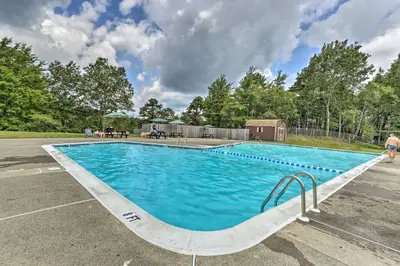a large blue swimming pool in a parking lot at Game Room! Lake-View Gem 7 Mi to Camelback Slopes in Long Pond