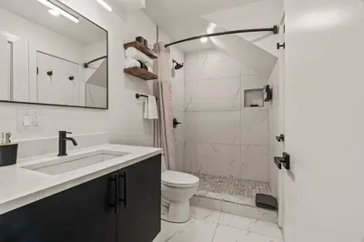 a bathroom with a sink and a toilet and a shower at Townhouse SLEEP 4 Walk to Liberty Bell |Old City in Philadelphia
